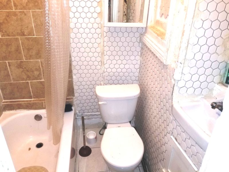 bathroom in mixed use building for sale at maltz auctions