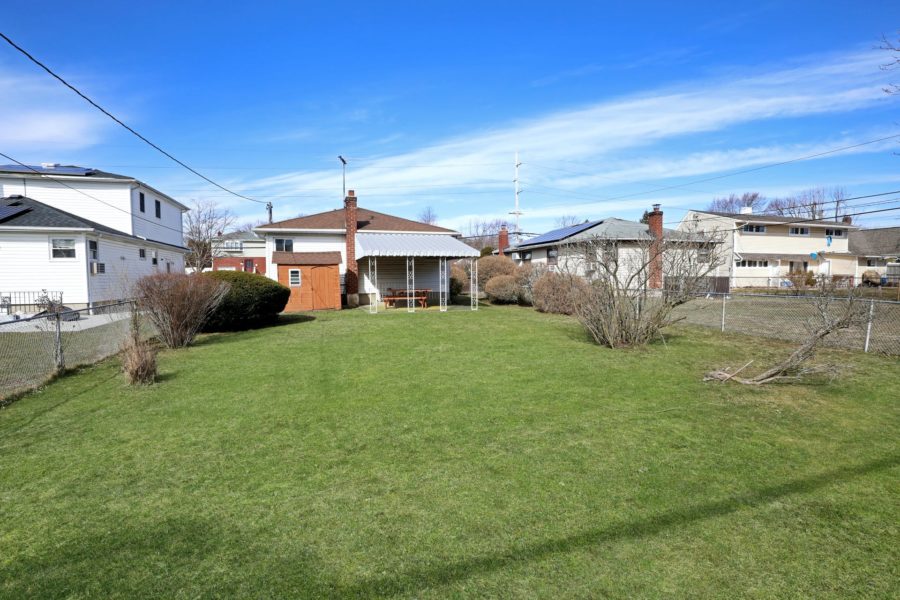 exterior backyard view of home for sale at maltz auctions in new york