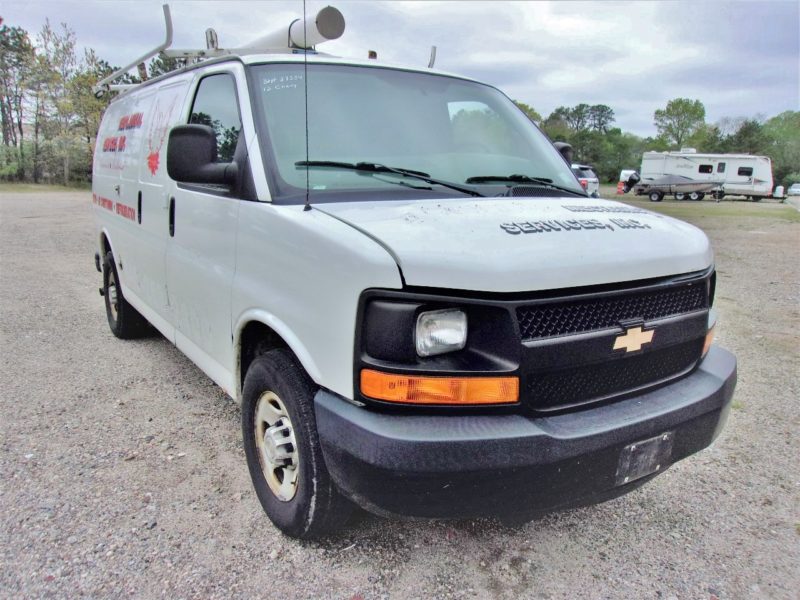 front of white van for sale at maltz auto auctions