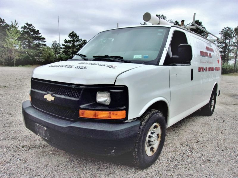 front of white van for sale at maltz auto auctions