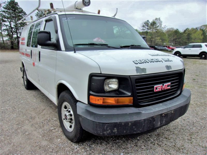 front of white van for sale at maltz auto auctions