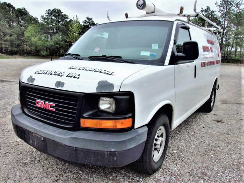 front of white van for sale at maltz auto auctions