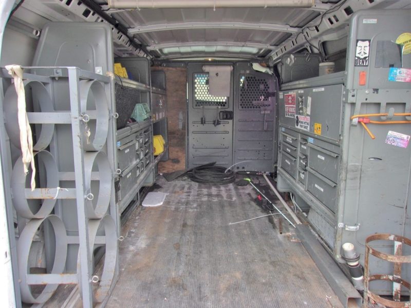 inside of white van for sale at maltz auto auctions
