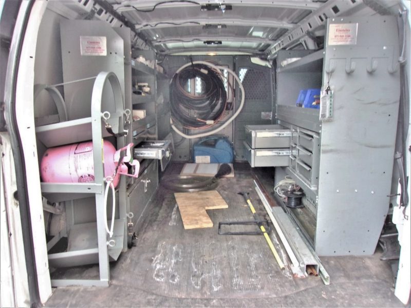 inside of blue mini van for sale at maltz auto auctions