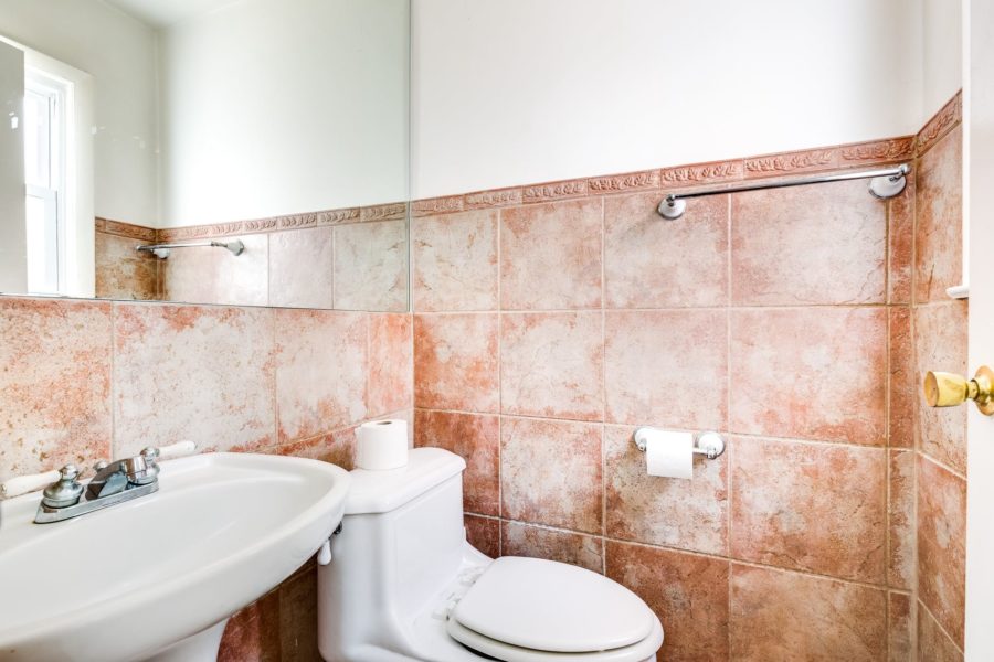 toliet and sink in 4 bedroom home for sale at maltz auctions
