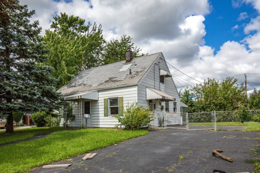front of home for sale at Maltz Auctions in New York